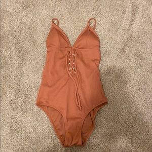 One piece coral swimsuit.